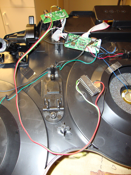An ATmega88PA microcontroller wired up to the Guitar Hero drum set circuit board.